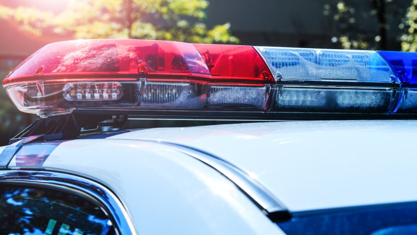 Police force department in full activity. Red light flasher of a patrol police car at sunday. Day patrolling of the city with lights flashers turned off. Security siren of the Canadian police.