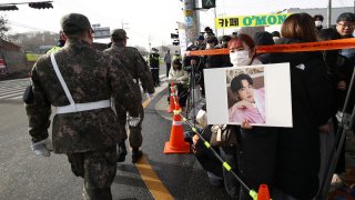 Fans wait to see BTS’s Jin join the military in front of the 5th Infantry Division recruit training center, on Dec. 13, 2022 in Yeoncheon-gun, South Korea.