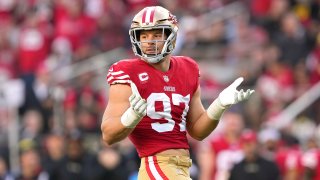Nick Bosa #97 of the San Francisco 49ers reacts after sacking the quarterback.