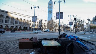 A homeless man is seen near the Ferry Building in San Francisco.