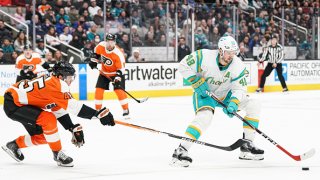 SAN JOSE, CA – DECEMBER 29: Tomas Hertl #48 of the San Jose Sharks skates with the puck against Cam York #45 of the Philadelphia Flyers at SAP Center on December 29, 2022 in San Jose, California. (Photo by Kavin Mistry/NHLI via Getty Images)