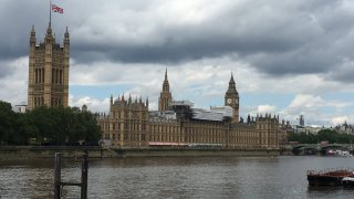 The Union Jack flag flies on top the British Parliament Building in London, England.