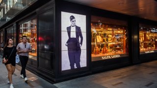 Pedestrians walk past a Ralph Lauren Corp. store in the Central district of Hong Kong, China, on Sunday, Oct. 27, 2019.