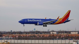 A Southwest Airlines passenger jet lands at Chicago Midway International Airport in Chicago, Illinois, on December 28, 2022.