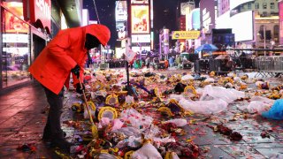 A worker cleans the street after the first public New Year’s event since the Covid pandemic, at Times Square, in the Manhattan borough of New York City, New York, U.S., Jan. 1, 2023.
