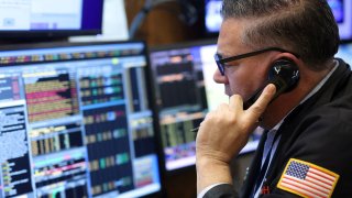 A trader works on the trading floor at the New York Stock Exchange (NYSE), January 5, 2023.