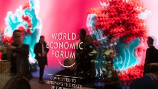 The data sculpture “Artificial Realities: Coral” by Turkish-born artist Refik Anadol is reflected in a window at Davos Congress Centre, the venue of the World Economic Forum (WEF) 2023, in the Alpine resort of Davos, Switzerland, January 17, 2023.