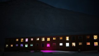 Windows light up the polar night in Longyearbyen, Norway