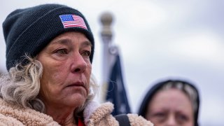 Micki Witthoeft, mother of Ashli Babbitt, stands with supporters of protesters that were arrested on Jan 6, 2021, as they protest outside the U.S. Supreme Court Friday on the second anniversary of the Capitol insurrection.