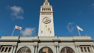 FILE: – 2013/04/06: The San Francisco Ferry Building is a terminal for ferries that travel across the San Francisco Bay, a marketplace on The Embarcadero in San Francisco. On top of the building is a 245-foot tall clock tower, Designed by American architect A. Page Brown in the Beaux Arts style the ferry building was completed in 1898. In 2002, a restoration and renovation were undertaken to redevelop the entire complex. During daylight, on every full and half-hour, the clock bell chimes portions of the Westminster Quarters. The ferry terminal is a designated San Francisco landmark and is listed on the National Register of Historic Places.. (Photo by John S Lander/LightRocket via Getty Images)