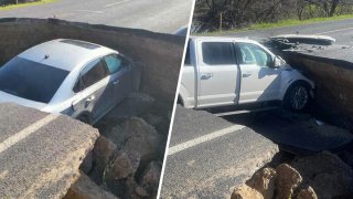 Vehicles after crashing into a hole on a washed-out stretch of roadway in San Joaquin County.