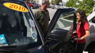 A man shops for used vehicles at the Toyota of Deerfield dealership in Deerfield Beach, Florida.