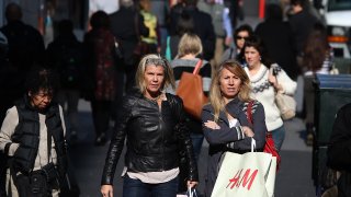 Pedestrians carry shopping bags on January 14, 2015 in San Francisco, California.