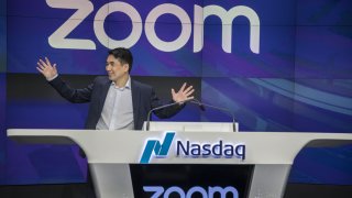 Eric Yuan, founder and CEO of Zoom Video Communications, stands before the opening bell during the company’s initial public offering at the Nasdaq MarketSite in New York on April 18, 2019.