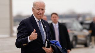 U.S. President Joe Biden gestures to reporters before boarding Air Force One en route to Camp David at Hancock Field Air National Guard Base in Syracuse, New York, U.S., February 4, 2023. 
