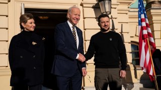 US President Joe Biden (C) meets with Ukrainian President Volodymyr Zelensky (R) and his wife Olena Zelenska at Mariinsky Palace during an unannounced visit in Kyivon February 20, 2023.