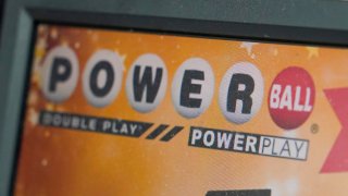 FILE β A display panel advertises tickets for a Powerball drawing at a convenience store, Nov. 7, 2022, in Renfrew, Pa. .