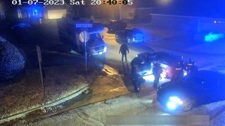 In this image from video released and partially redacted by the city of Memphis, Tenn., on Jan. 27, 2023, Tyre Nichols leans against a car after a brutal attack by five Memphis Police officers on Jan. 7, in Memphis.