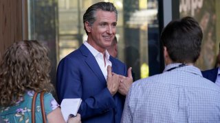 California Gov. Gavin Newsom speaks with reporters said on Friday, Oct. 7, 2022, in Sacramento. California lawmakers are having their first public hearing on a proposal to penalize some oil company profits.