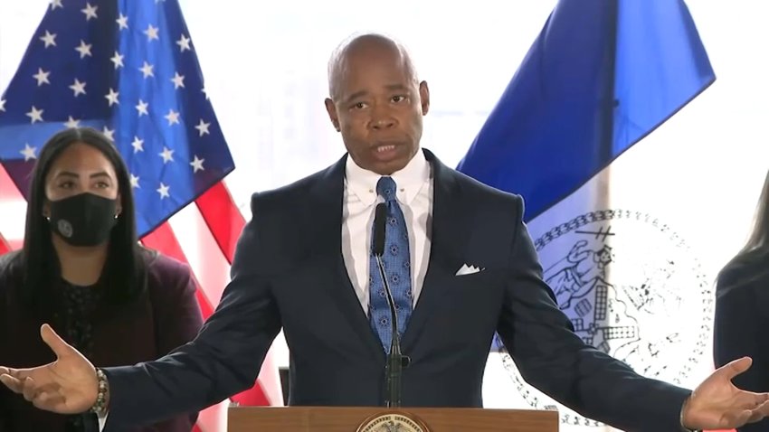 NYC Mayor Eric Adams at a podium.