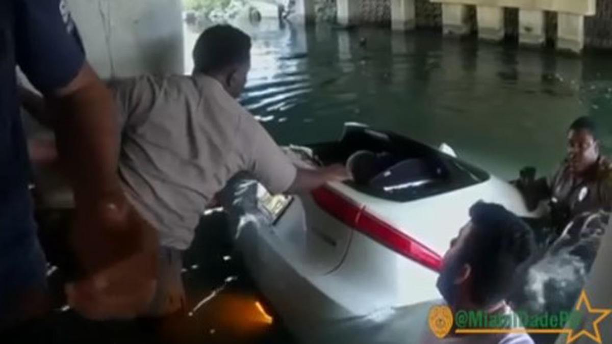 Video Shows MiamiDade Officers Rescuing Boy Trapped in Submerged Car