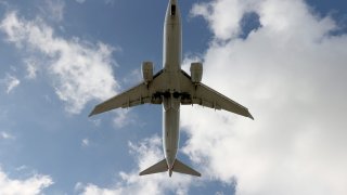 An American Airlines Boeing 787-9 Dreamliner approaches for a landing at the Miami International Airport on December 10, 2021 in Miami, Florida.