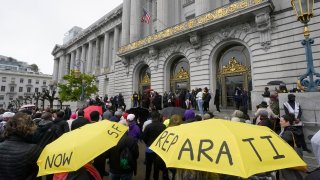 A crowd listens to speakers at a reparations rally outside of City Hall in San Francisco, March 14, 2023. Supervisors in San Francisco are taking up a draft reparations proposal that includes a $5 million lump-sum payment for every eligible Black person.
