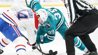 SAN JOSE, CA – FEBRUARY 28: Logan Couture #39 of the San Jose Sharks takes a face-off against Nick Suzuki #14 of the Montreal Canadiens at SAP Center on February 28, 2023 in San Jose, California. (Photo by Kavin Mistry/NHLI via Getty Images)