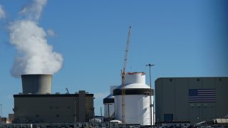 FILE - Reactor number 3 and its cooling tower stand at Georgia Power Co.'s Plant Vogtle nuclear power plant on Jan. 20, 2023, in Waynesboro, Ga.