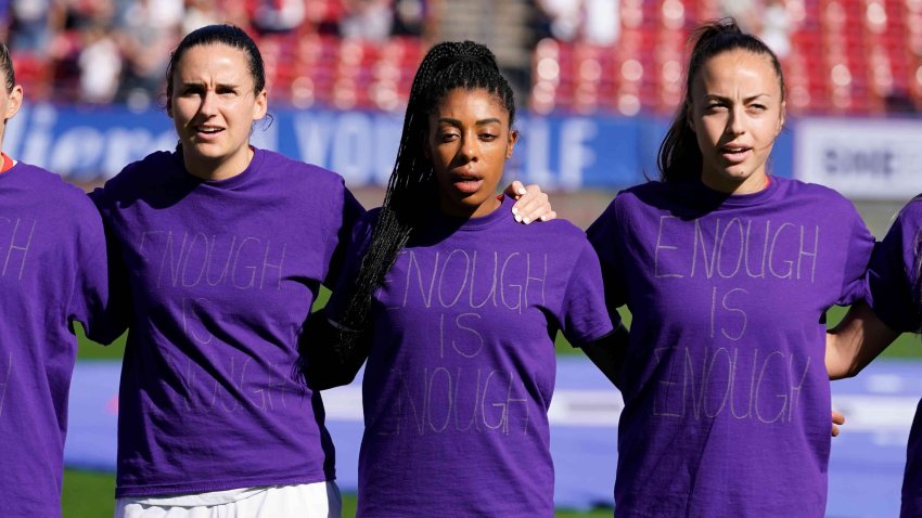 Canada’s Evelyne Viens, left, Ashley Lawrence, center and Julia Grosso ( 7) wear their shirts inside out during the national anthem before a SheBelieves Cup soccer match against Japan Wednesday, Feb. 22, 2023, in Frisco, Texas.