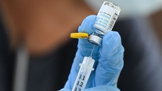 A health care worker prepares a dose of the JYNNEOS Monkeypox vaccine at a pop-up vaccination clinic in Los Angeles, California, on August 9, 2022.