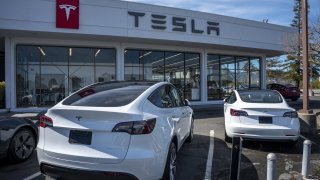 A vehicle charges a Tesla Supercharging station in Corte Madera, California, US, on Thursday, March 2, 2023.