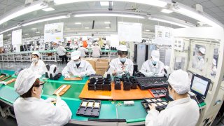 Workers at a factory making lithium battery products for domestic and international markets in Nantong, Jiangsu province, China.