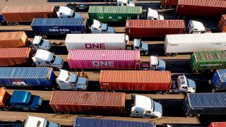 FILE – Trucks line up to enter a Port of Oakland shipping terminal on Nov. 10, 2021, in Oakland, Calif. (AP Photo/Noah Berger, File)