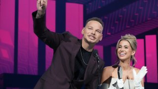 AUSTIN, TEXAS – APRIL 02: (L-R) Kane Brown and Katelyn Jae Brown, winners of Video of the Year for “Thank God,” speak onstage during the 2023 CMT Music Awards at Moody Center on April 02, 2023 in Austin, Texas. (Photo by Jeff Kravitz/Getty Images for CMT)