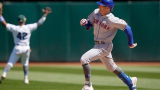 OAKLAND, CALIFORNIA – APRIL 15: Brandon Nimmo #9 of the New York Mets races into second base with an RBI double against the Oakland Athletics in the top of the sevent inning at RingCentral Coliseum on April 15, 2023 in Oakland, California. All players are wearing the number 42 in honor of Jackie Robinson Day. (Photo by Thearon W. Henderson/Getty Images)