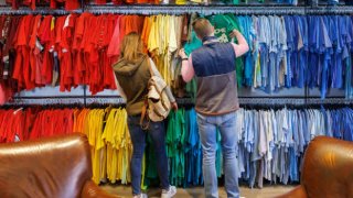 Shoppers browse shirts at a clothing store in Atlanta, Georgia, on Tuesday, Feb. 14, 2023.
