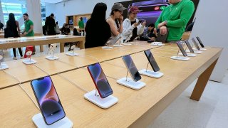 Apple phones on display in an Apple store on May 04, 2023 in Miami, Florida.