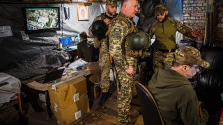 Ukrainian servicemen of the State Border Guard Service watch drone feeds from an underground bomb shelter near the frontline city of Bakhmut, Donetsk region on May 3, 2023, amid the Russian invasion of Ukraine.