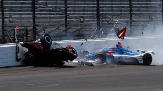 Katherine Legge, of England, left, and Stefan Wilson, of England, crash in the first turn during practice for the Indianapolis 500 at Indianapolis Motor Speedway in Indianapolis, Tuesday, May 23, 2023.