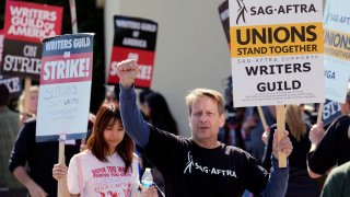 Actor and SAG-AFTRA member Jeffrey Reeves takes part in a Writers Guild of America rally outside Paramount Pictures studio