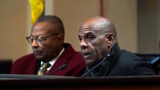 Task Force members Steven Bradford, right, speaks next to Reginald Jones-Sawyer during a meeting by the Task Force to Study and Develop Reparation Proposals for African Americans, Wednesday, Dec. 14, 2022, in Oakland, Calif.