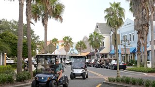 Residents drive golf carts