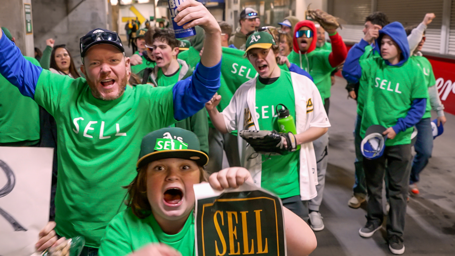 Oakland Athletics fans hang signs at RingCentral Coliseum to protest the  team's potential move to Las Vegas and to call for team owner John Fisher  to sell the team during a baseball