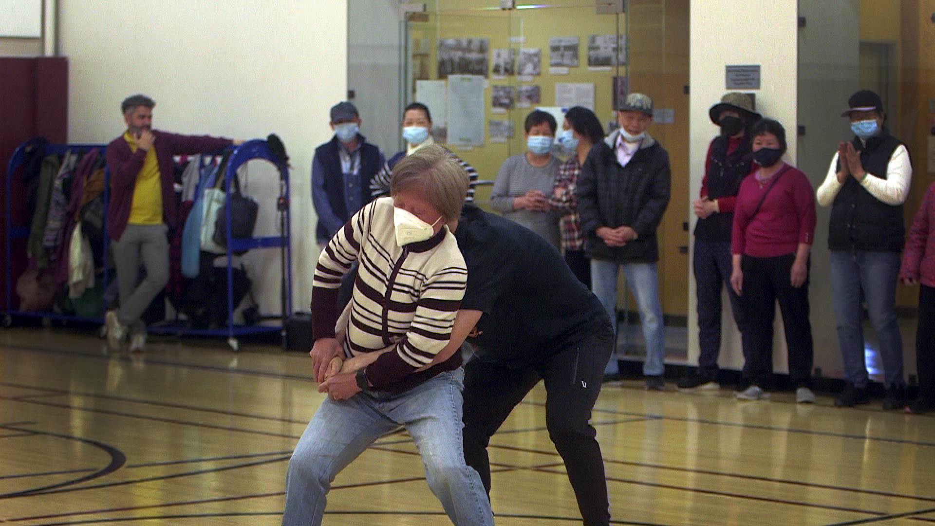 Hudson Liao teaches a senior citizen to break the grip of an attacker during a recent class in the Chinatown YMCA.