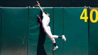 Esteury Ruiz #1 of the Oakland Athletics leaps at the center field wall.
