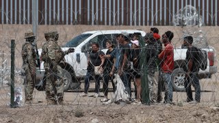 Military personnel are seen as migrants try to cross the United States border before the Title 42 policy, which allows for the immediate expulsion of irregular migrants entering the country, comes to an end, in Ciudad Juarez, Mexico on May 11, 2023.