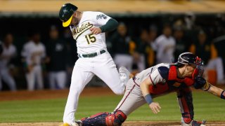 OAKLAND, CALIFORNIA – MAY 30: Seth Brown #15 of the Oakland Athletics crosses home plate to score on a walk-off single by Jonah Bride #26 in the bottom of the ninth inning to defeat the Atlanta Braves at RingCentral Coliseum on May 30, 2023 in Oakland, California. (Photo by Lachlan Cunningham/Getty Images)