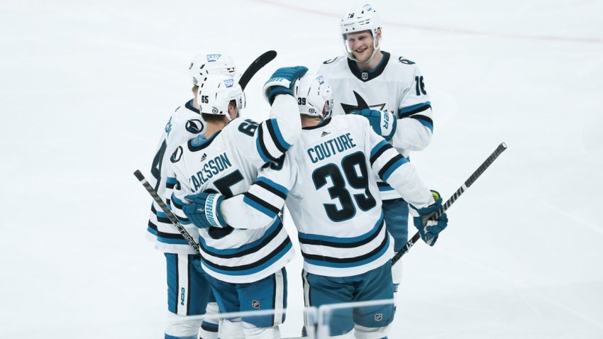 Apr 10, 2023; Winnipeg, Manitoba, CAN; San Jose Sharks defenseman Erik Karlsson (65) is congratulated by his team mates on his goal against the Winnipeg Jets during the third period at Canada Life Centre. Mandatory Credit: Terrence Lee-USA TODAY Sports