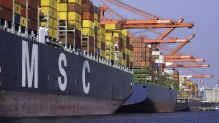 Cargo is loaded onto a container ship at the Port of Long Beach in Long Beach, California, on Thursday, Oct. 13, 2022.